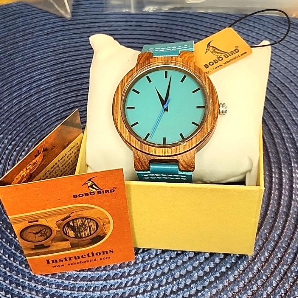WATCH with wooden case and leather strap.